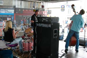 drummer and double-bassist on stage at street festival