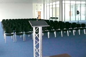 lectern, microphone and chairs set out for staff briefing